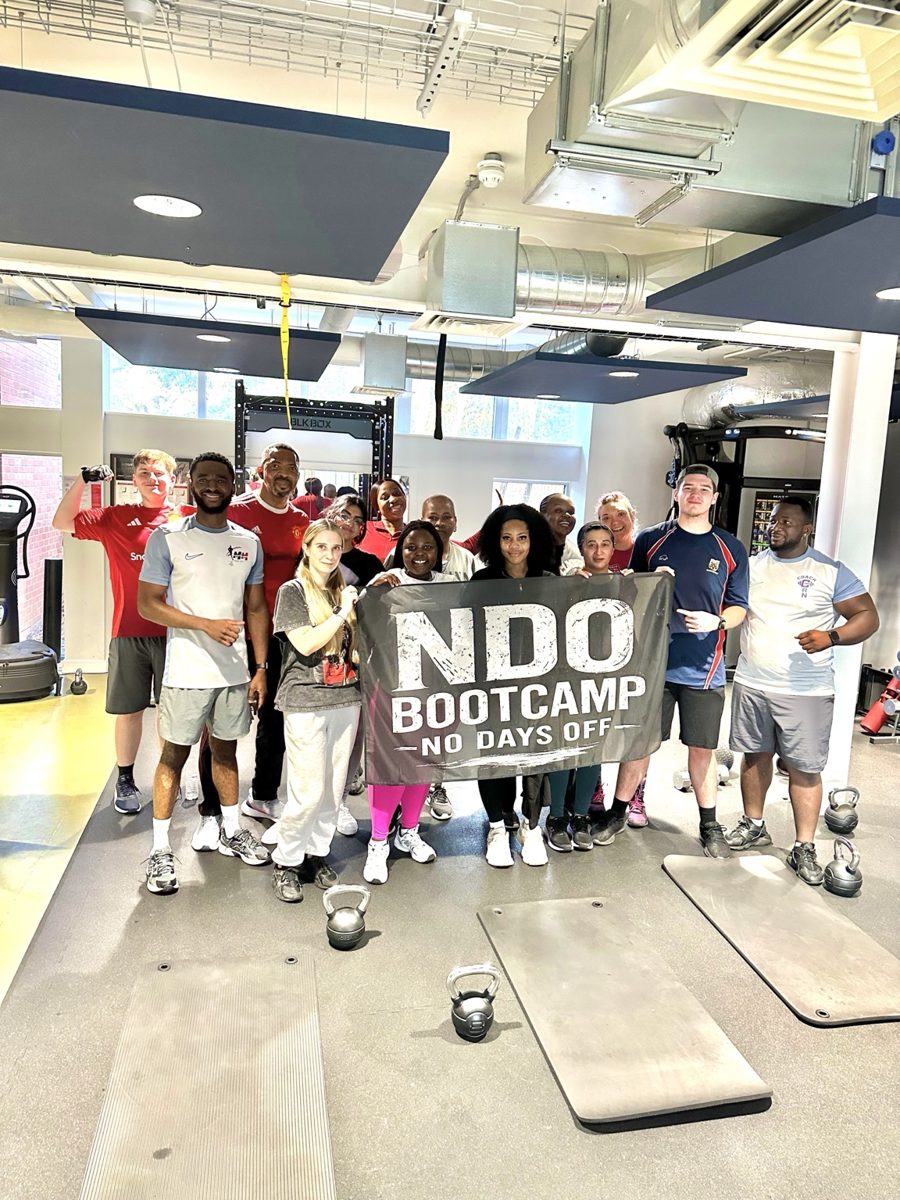 NDO Bootcamp group holding their banner